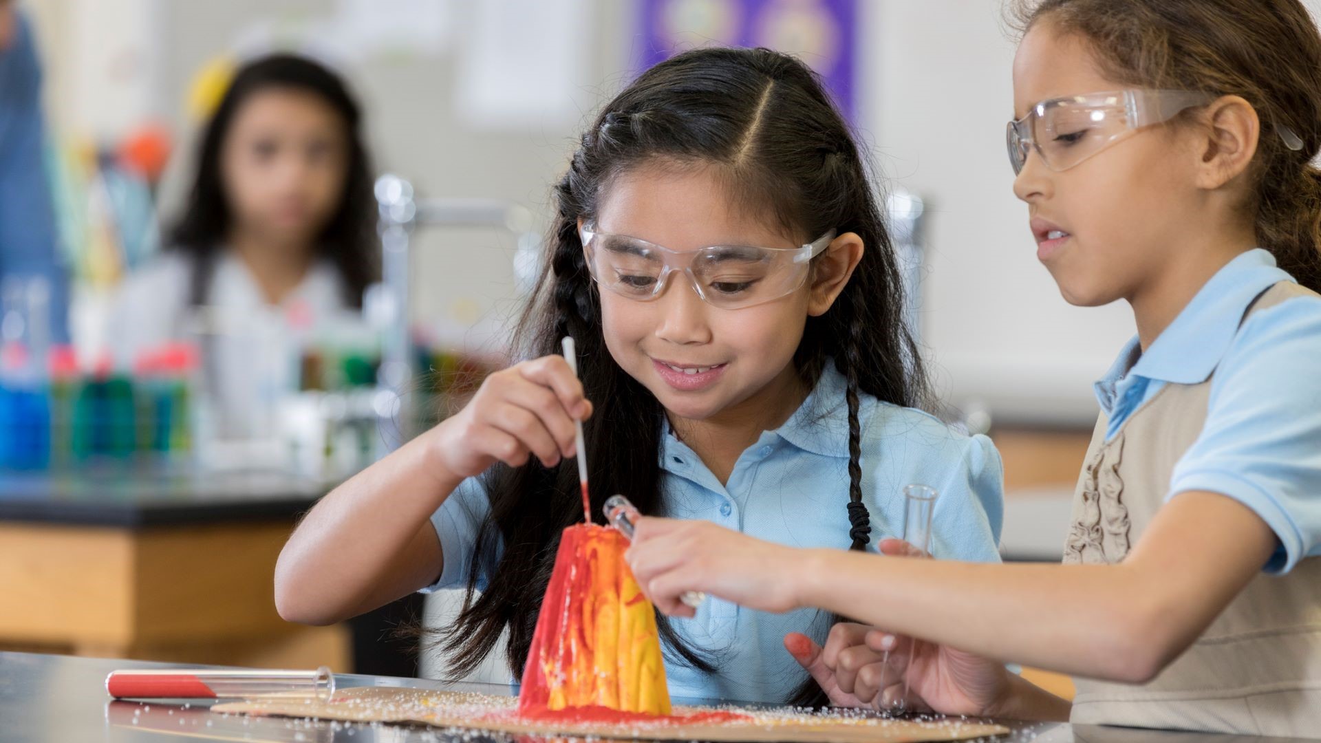 elementary students doing science experiment