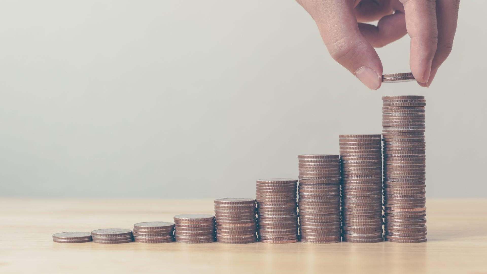 rising stacks of coins